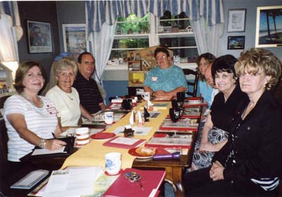 Members gather around table